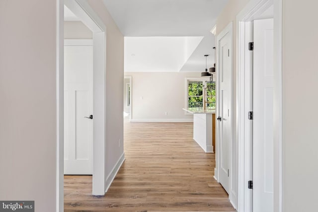 hall with light hardwood / wood-style floors