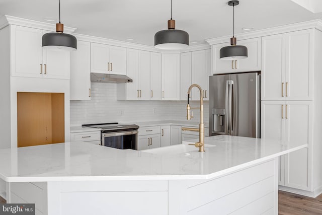 kitchen featuring white cabinets, hanging light fixtures, light wood-type flooring, light stone countertops, and stainless steel appliances