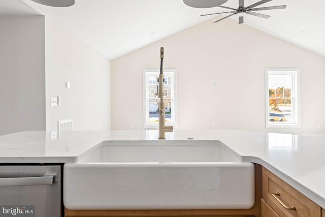 kitchen with dishwasher, ceiling fan, and vaulted ceiling