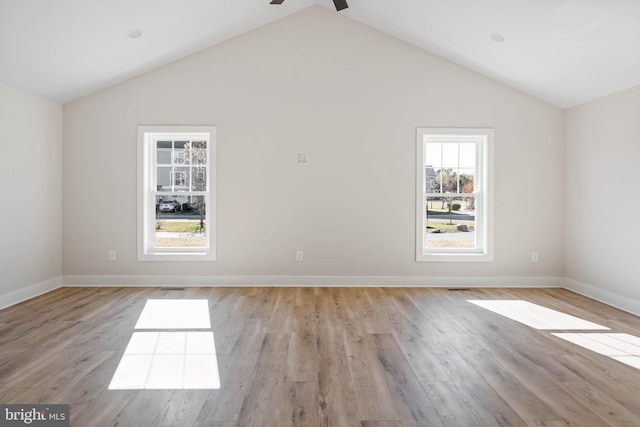 spare room featuring ceiling fan, high vaulted ceiling, and light hardwood / wood-style floors