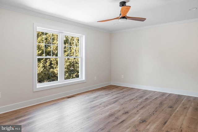 empty room with crown molding, light hardwood / wood-style flooring, and ceiling fan