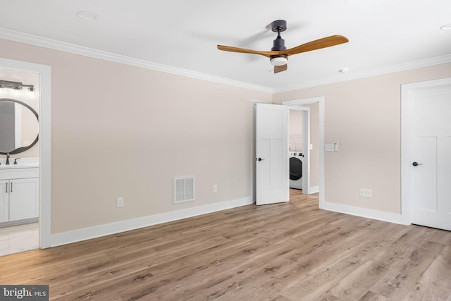 unfurnished bedroom with light hardwood / wood-style floors, sink, crown molding, and connected bathroom