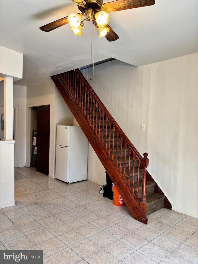 staircase with ceiling fan