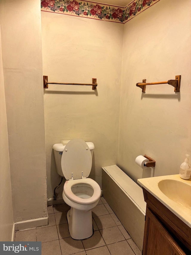 bathroom with tile patterned floors, vanity, and toilet