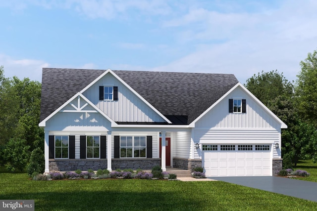 view of front facade featuring a front lawn and a garage