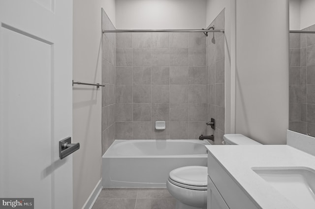 full bathroom with tile patterned flooring, vanity, toilet, and tiled shower / bath combo