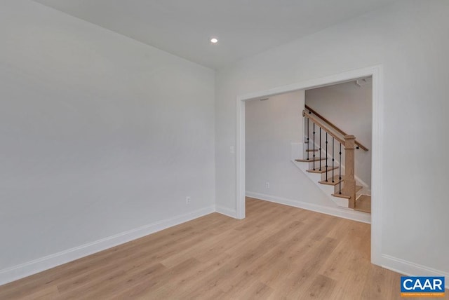 spare room featuring light hardwood / wood-style flooring