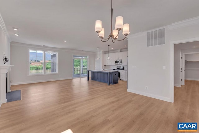 unfurnished living room with a chandelier, light hardwood / wood-style flooring, and crown molding