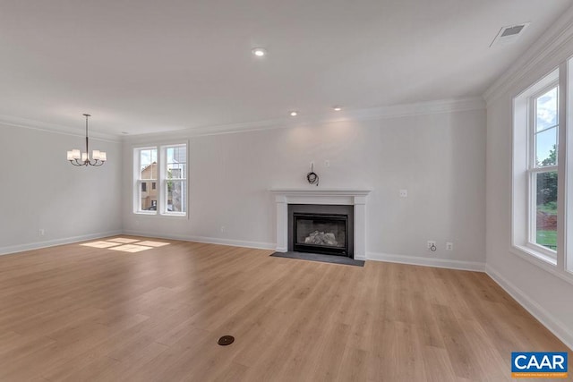 unfurnished living room with a wealth of natural light and light wood-type flooring