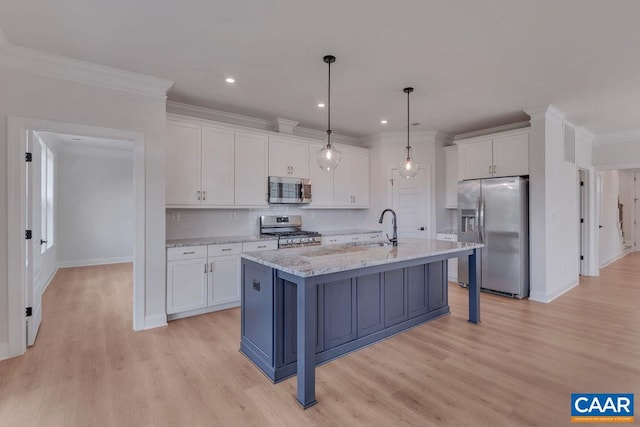 kitchen with stainless steel appliances, decorative light fixtures, light stone countertops, light hardwood / wood-style floors, and white cabinets