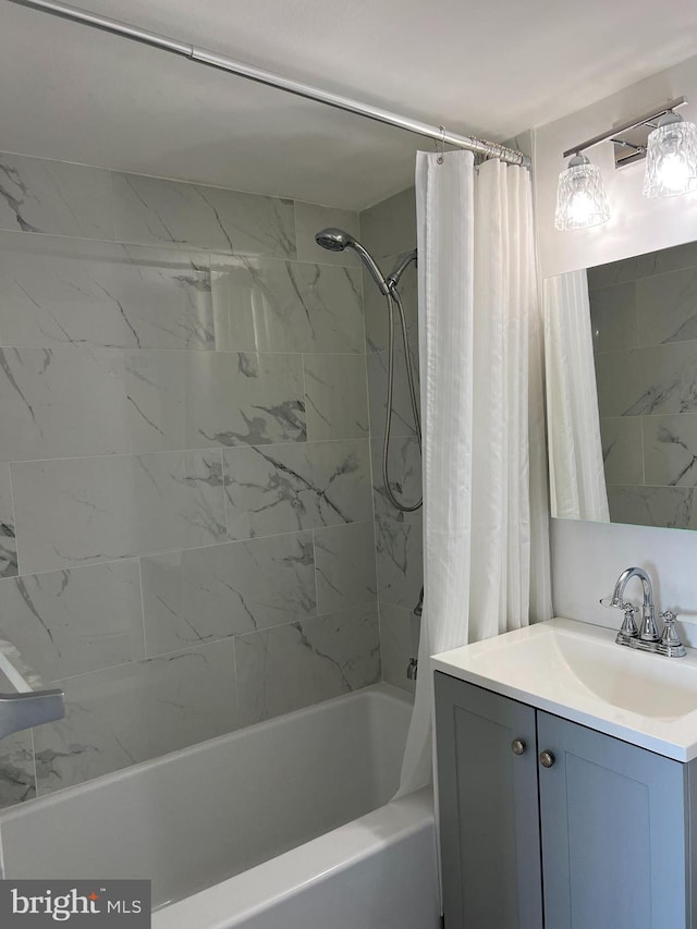 bathroom with shower / bath combo and vanity