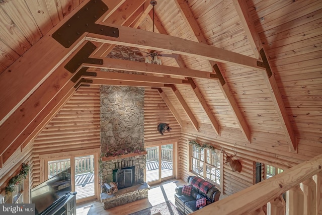 unfurnished living room featuring hardwood / wood-style floors, wooden ceiling, and high vaulted ceiling