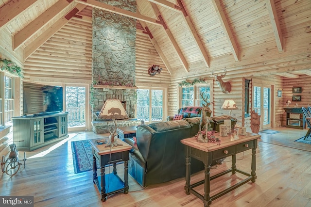 living room with high vaulted ceiling, hardwood / wood-style floors, and plenty of natural light