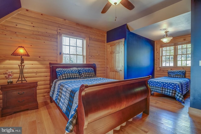 bedroom with hardwood / wood-style floors and ceiling fan