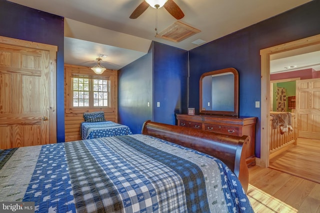 bedroom featuring vaulted ceiling, hardwood / wood-style flooring, and ceiling fan