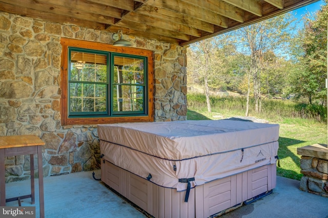 view of patio with a hot tub