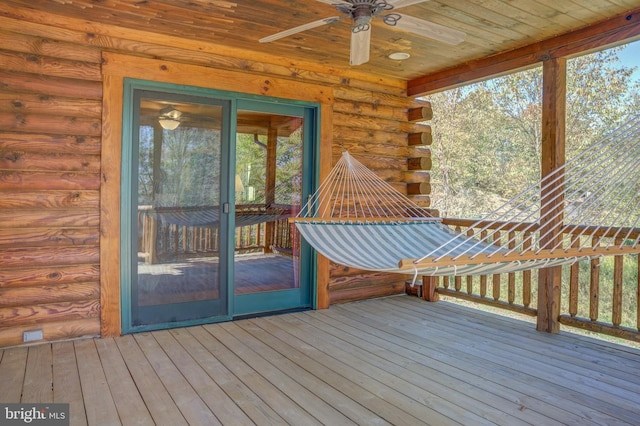 wooden terrace featuring ceiling fan