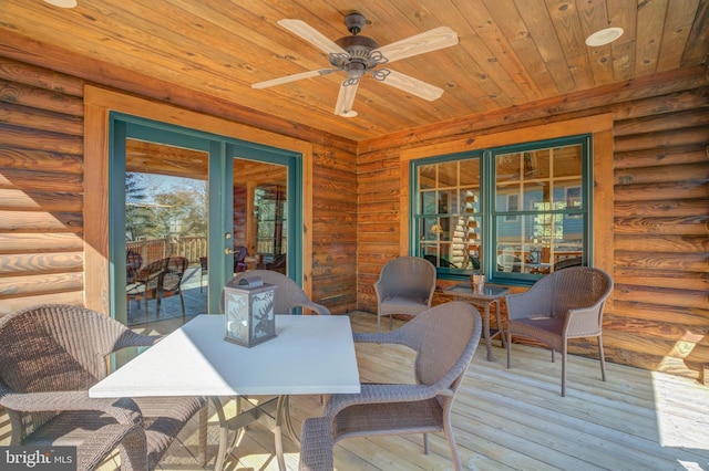 wooden terrace featuring ceiling fan