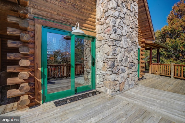 entrance to property with a wooden deck