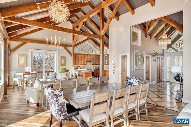 dining area featuring wood-type flooring, high vaulted ceiling, beamed ceiling, a chandelier, and wooden ceiling