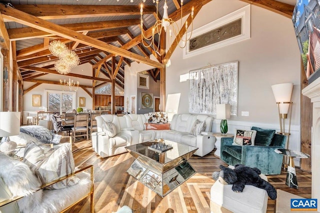 living room featuring hardwood / wood-style flooring, high vaulted ceiling, and beamed ceiling