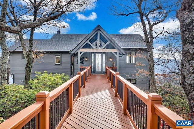 back of house with french doors and a wooden deck