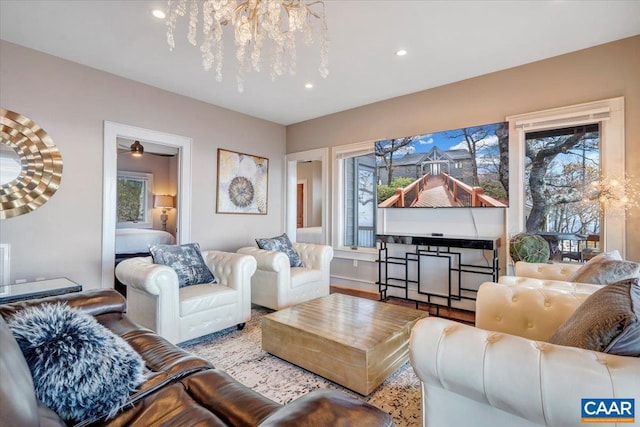 living room with plenty of natural light and light hardwood / wood-style flooring