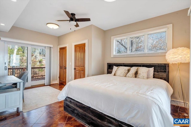 tiled bedroom with ceiling fan and access to exterior