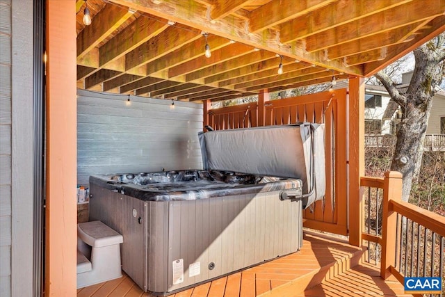 deck with a hot tub