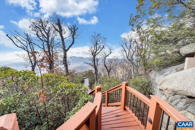 wooden deck featuring a mountain view