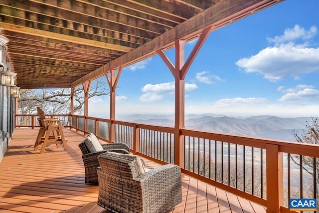 wooden terrace featuring a mountain view