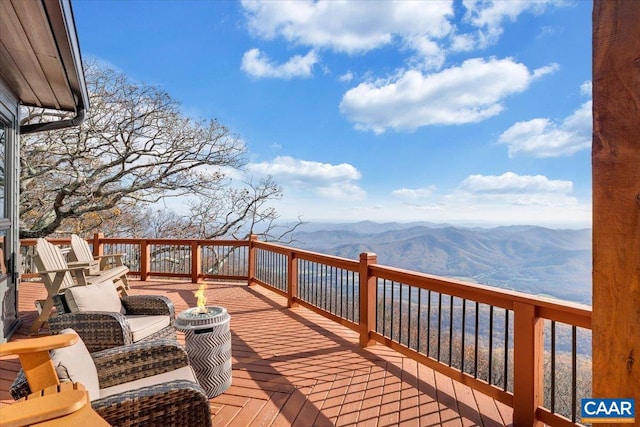 wooden terrace featuring a mountain view