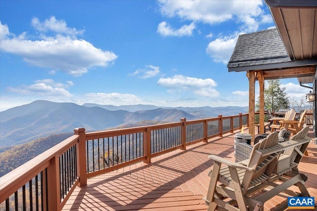 wooden terrace featuring a mountain view