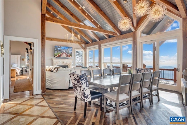 dining space featuring high vaulted ceiling, beamed ceiling, and hardwood / wood-style flooring