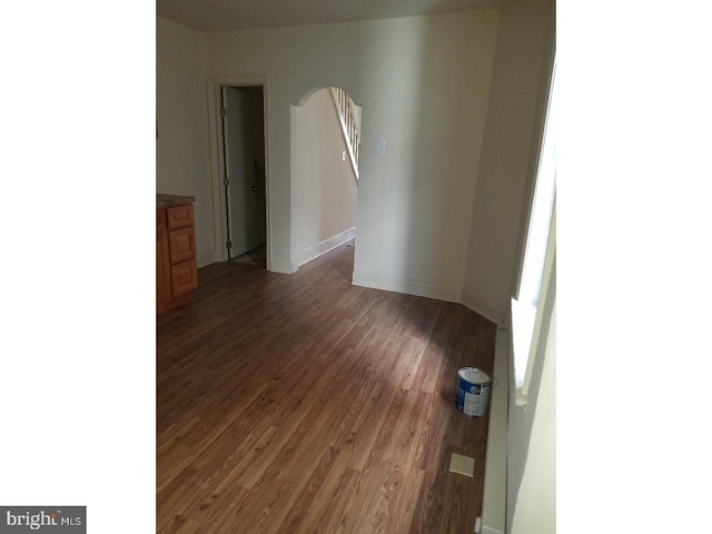 empty room featuring dark wood-type flooring