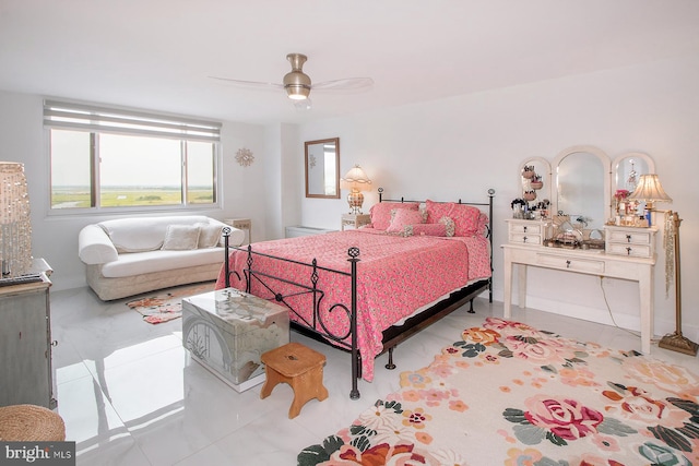 bedroom with ceiling fan and light tile patterned floors