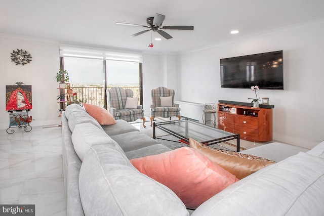 living room with ornamental molding and ceiling fan