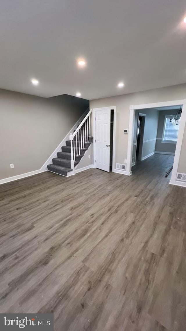 unfurnished living room featuring wood-type flooring