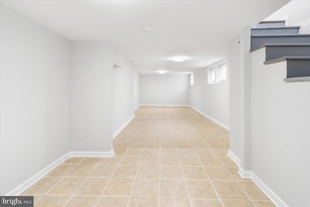 basement with light tile patterned flooring