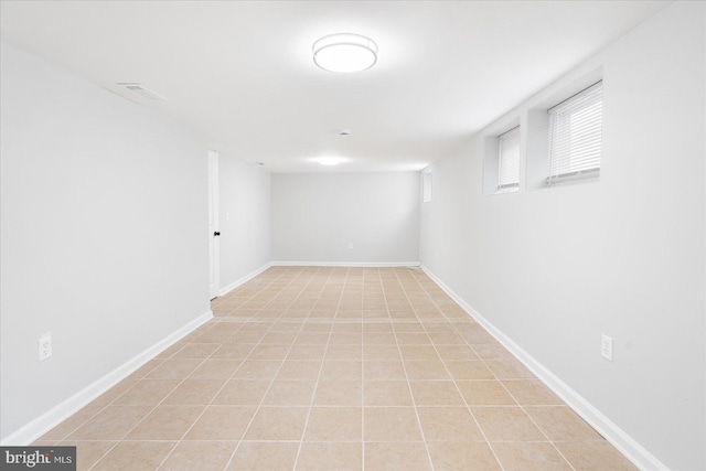 basement featuring light tile patterned floors