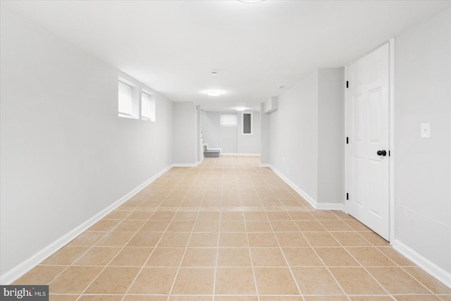 basement with light tile patterned flooring