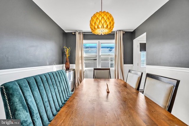 dining space featuring wood-type flooring