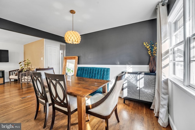 dining room with dark hardwood / wood-style floors