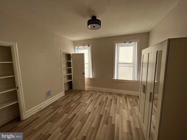 unfurnished bedroom with light hardwood / wood-style flooring