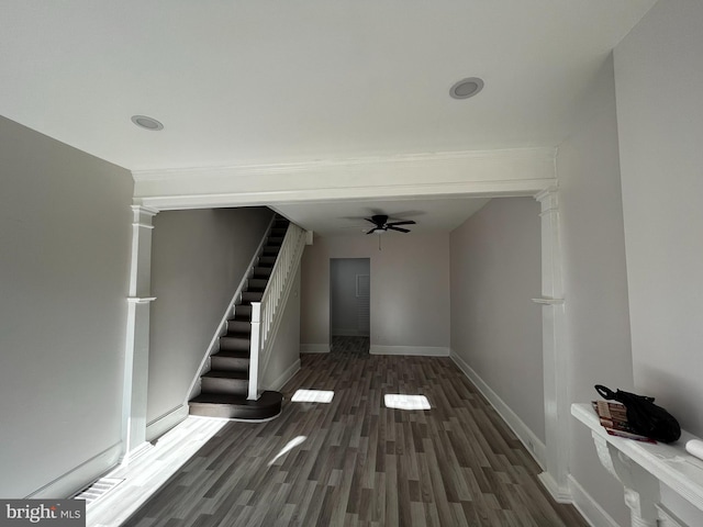 interior space with dark hardwood / wood-style flooring and ceiling fan