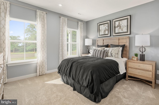 bedroom with light colored carpet