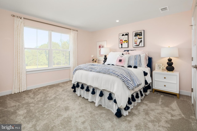 bedroom with light colored carpet