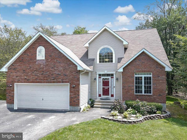 view of front of home featuring a garage and a front lawn