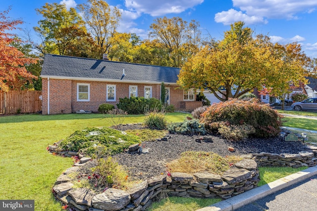 single story home featuring a front yard