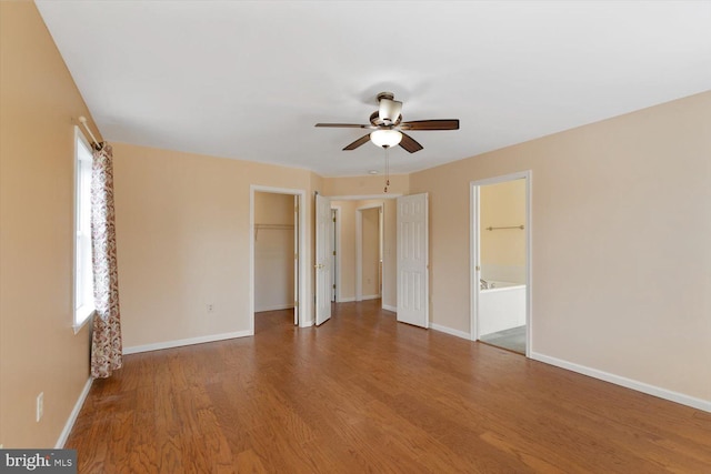 spare room featuring hardwood / wood-style flooring and ceiling fan